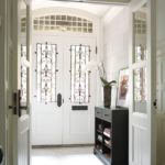 Vestibule with white walls and leaded glass