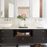 Contemporary bathroom with dark vanity and vessel sinks
