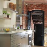 Modern gray kitchen with exposed brick designed by Meichi Peng