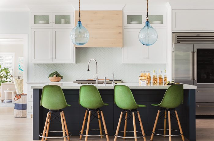 White kitchen with green stools