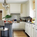 Updated traditional classic Shaker-style cabinets with honed black granite countertops