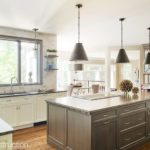 Transitional style kitchen with a mix of white cabinets and light wood built by FBN Construction