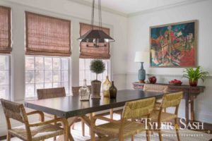 Dining nook with relaxed Roman shades