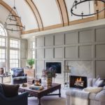 Living room with custom panelling nhosting television and fireplace
