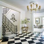 Foyer with wrought-iron banister and marble floor