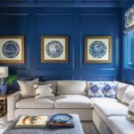 A cherry-paneled media room was painted blue