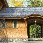 Vermont shingle style home eyebrow arch