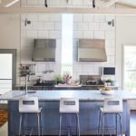 A stainless-steel and galvanized metal island defines the kitchen.