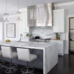 Kitchen with crystal pendants and stainless steel