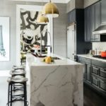 Kitchen with marble waterfall style island