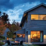 Exterior Stowe, Vermont home designed by Michele Foster at night