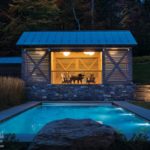 Pool house Stowe, Vermont home designed by Michele Foster at night
