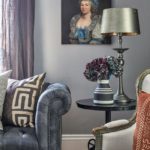 antique portraits, living room, family room, chesterfield sofa, African-print pillows