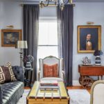 antique portraits, chesterfield sofa, African-print pillows, living room