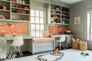 Homework room is painted light gray with orange and white patterned accents