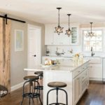 Mid-Cape Home Centers Kitchen with a distressed barn door