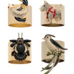 Napkin rings featuring jeweled a koi fish, a beetle, a scottie dog, a crab and a bird