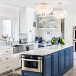 Mid-Cape Home Centers Kitchen with blue and white cabinets, stainless steel appliances and a stainless steel farmhouse sink