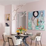 Dining room with pale pink walls and a round dining room table. The stilettos are in the corner.