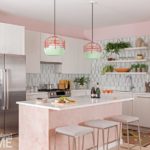 kitchen with white cabinets and a pink island. The appliances are stainless steel. The tiled backsplash is gray and white.