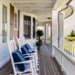 Porch with white rocking chairs