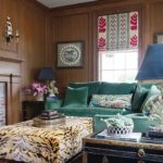 Study with green sofa and animal print ottoman