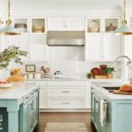 White kitchen with two light blue kitchen islands