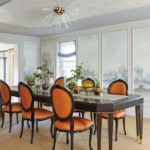 formal dining room with orange leather chairs.