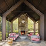 Large screened. porch with a stone floor andfireplace