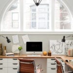 Office with white cabinetry and leather chair