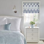 Pale gray bedroom with blue accents