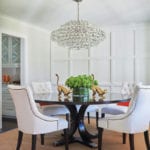A round dining table with bubble chandelier