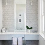 White powder room with concrete tiles by Artistic Tile.