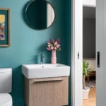 Turquoise bathroom with floating vanity