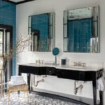 Art Deco inspired bathroom with dark vanity and white and blue tile