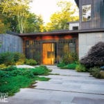 Entrance to contemporary Maine home with granite pavers.