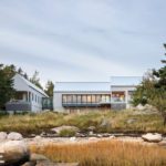 Contemporary coastal Maine home view from water.