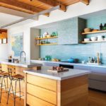 Contemporary kitchen with blue Heath Ceramics backsplash.