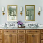 Large rustic wood bathroom vanity with marble top
