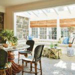 Sunroom with round table and built-in seating