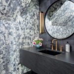 Powder room with floral wallpaper and floating vanity