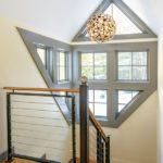 Stairwell with windows and iron railing