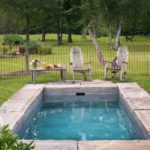 Small soak pool with natural stone surround