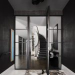 Dramatic dark entryway with a spiral staircase