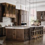 KItchen with dark wood cabinetry and a metal hood