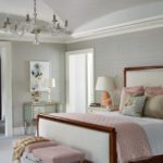 Main bedroom with neutral furnishings and a pink