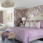Bedroom with lilac bedding and glamorous wallpaper.