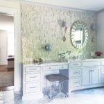 Marble topped vanity with makeup area.