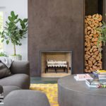contemporary plaster fireplace with large wood storage column