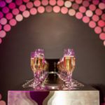 Mirrored bar with pink glassware